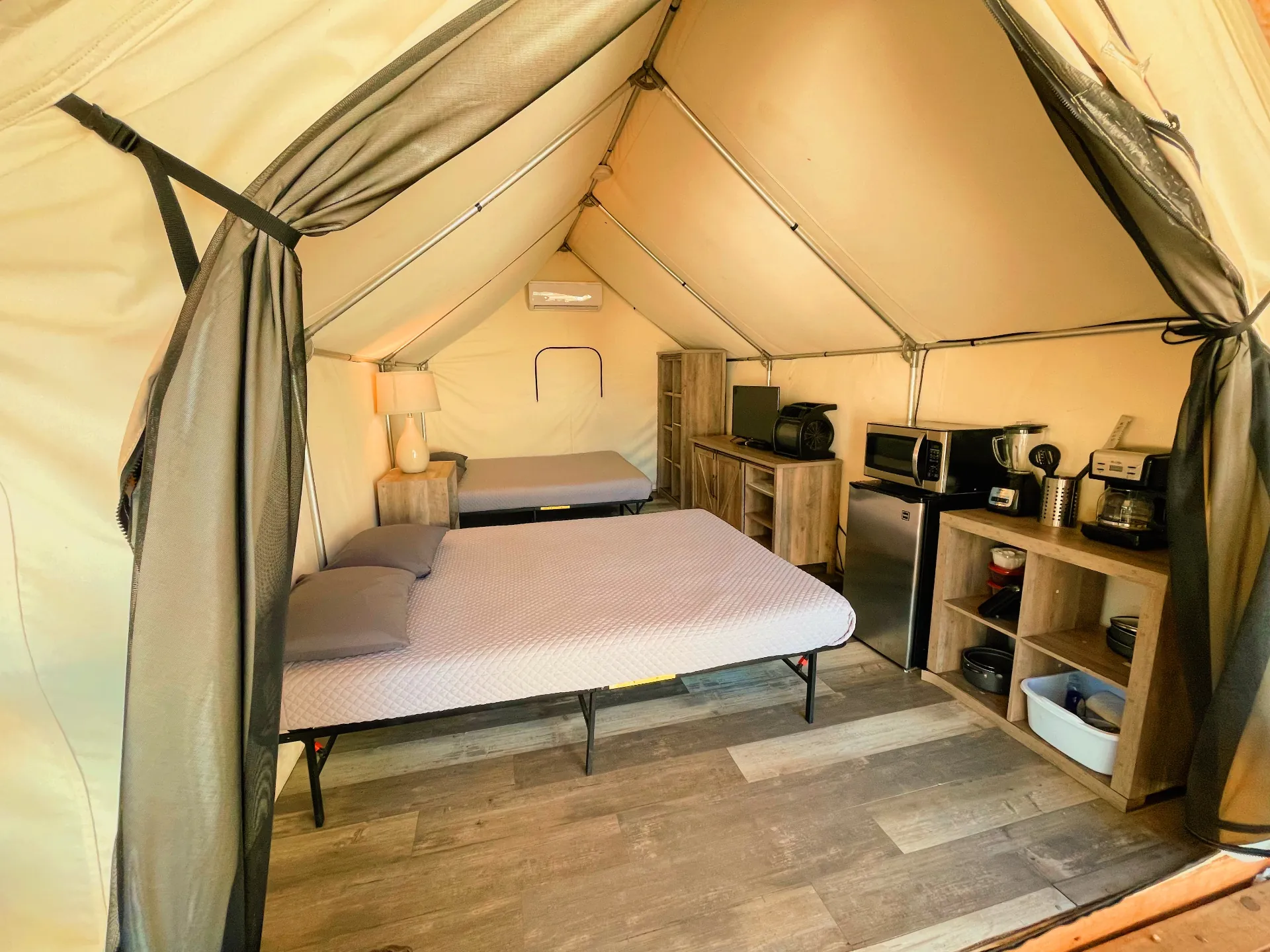Interior of an air-conditioned riverside glamping cabin in the Texas Hill Country