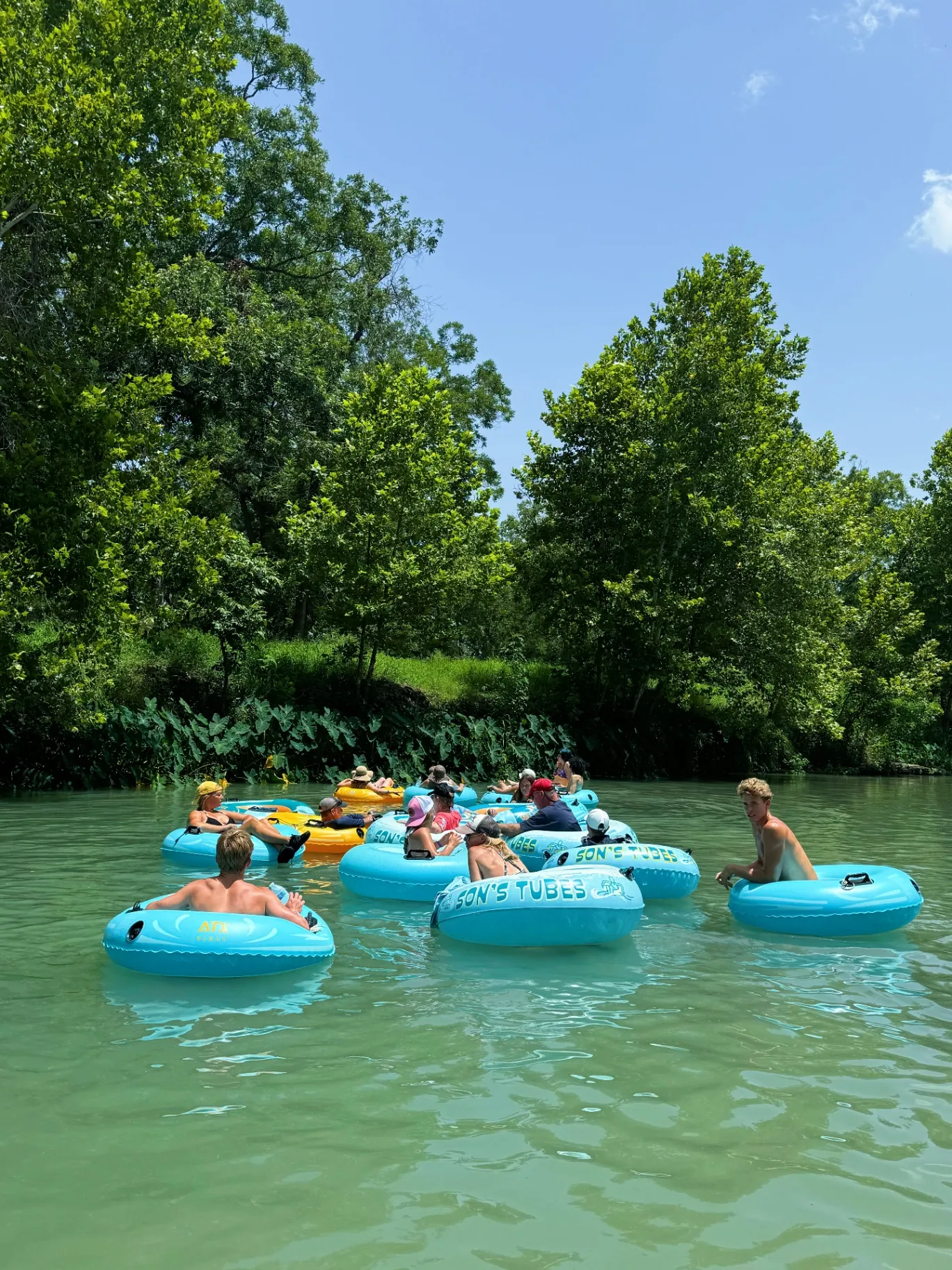 Family tubing the uncrowded San Marcos River near Austin, San Antonio and New Braunfels